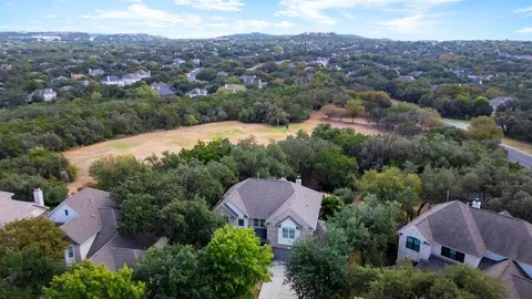 an aerial view of a house and yard