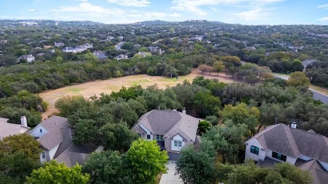 an aerial view of a house and yard