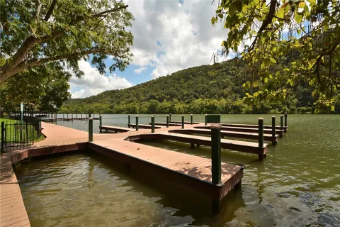 a view of swimming pool with chairs
