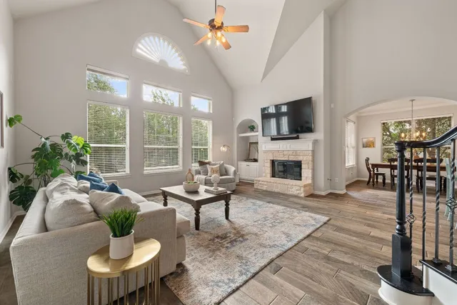 a living room with furniture fireplace and flat screen tv