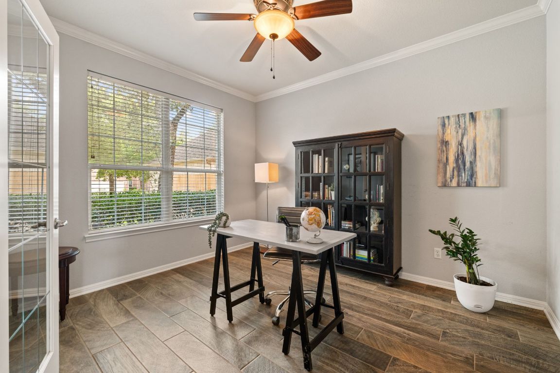 3209 Indigo Waters Drive Austin, TX 78732 - Photo 8 of 40 a workspace with furniture window and wooden floor