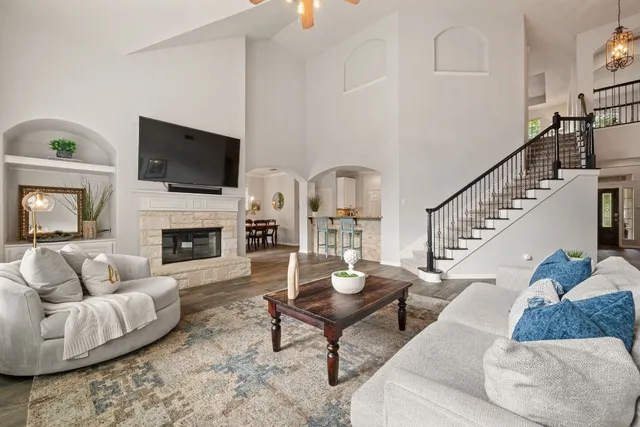 a living room with furniture fireplace and flat screen tv