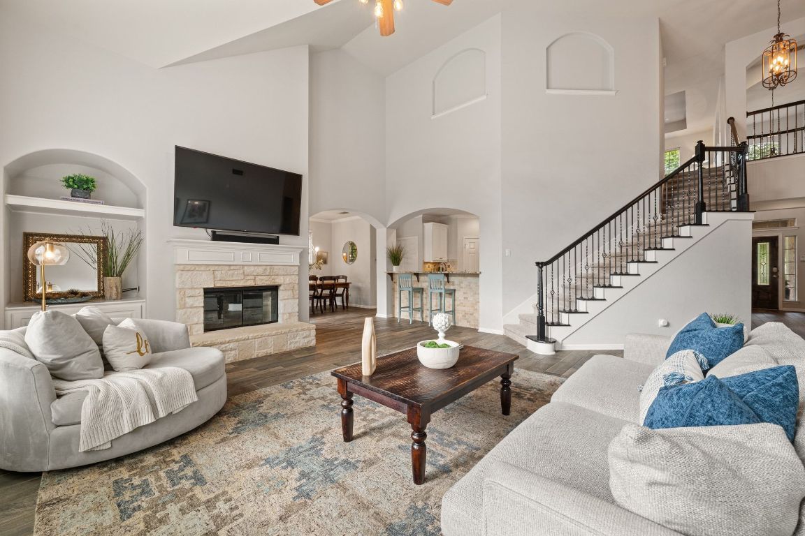 3209 Indigo Waters Drive Austin, TX 78732 - Photo 9 of 40 a living room with furniture fireplace and flat screen tv