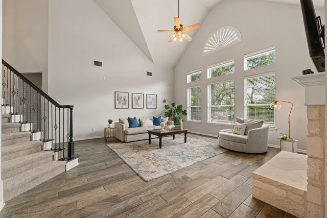 a living room with furniture and wooden floor