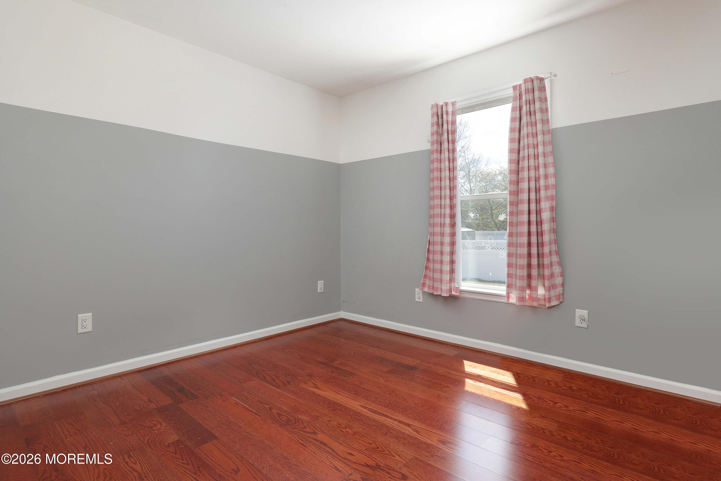 96 Atrium Drive Brick, NJ 08723 - Photo 20 of 39 a view of room with window and wooden floor
