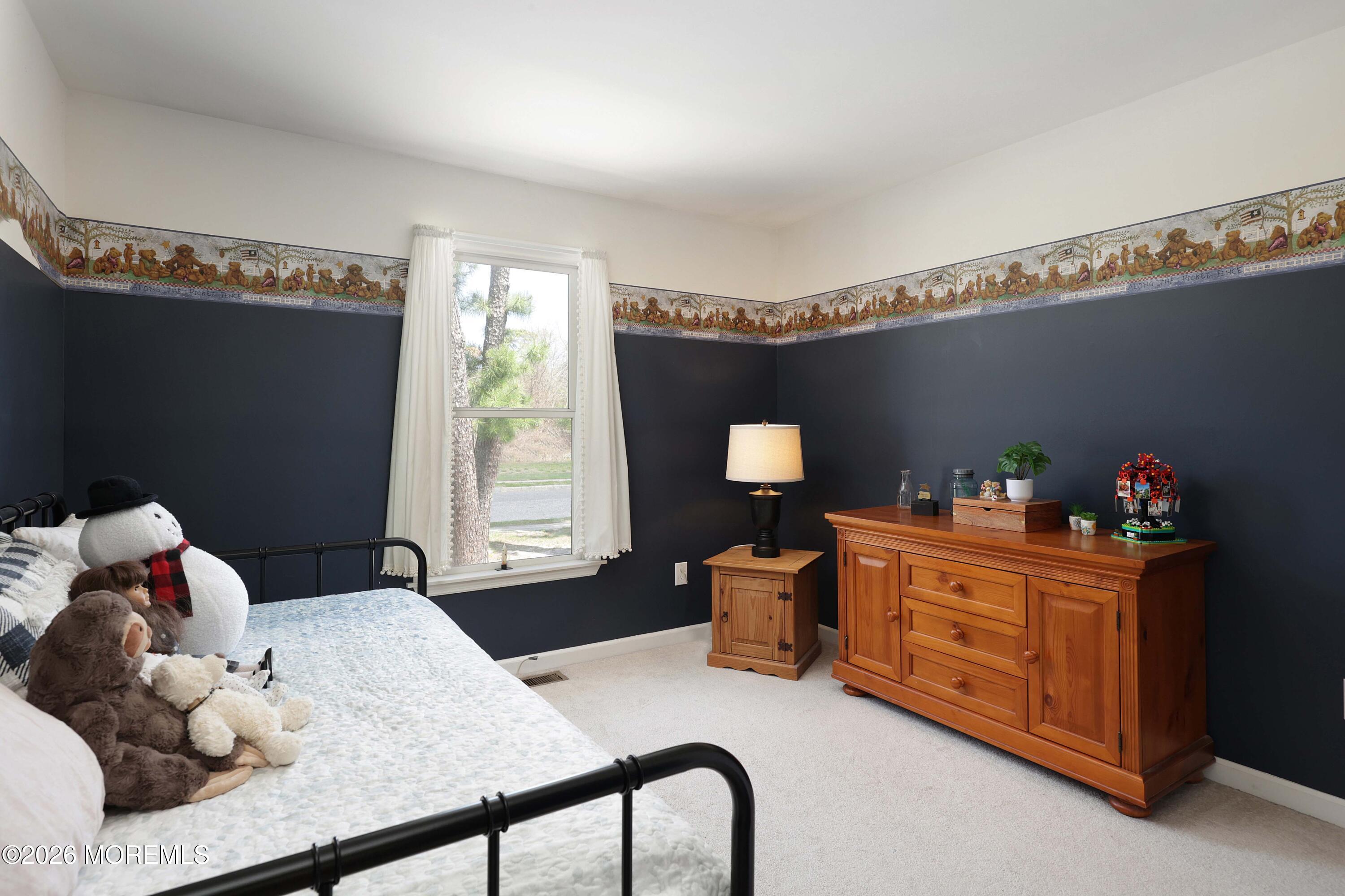 96 Atrium Drive Brick, NJ 08723 - Photo 21 of 39 a bedroom with a bed and a dresser