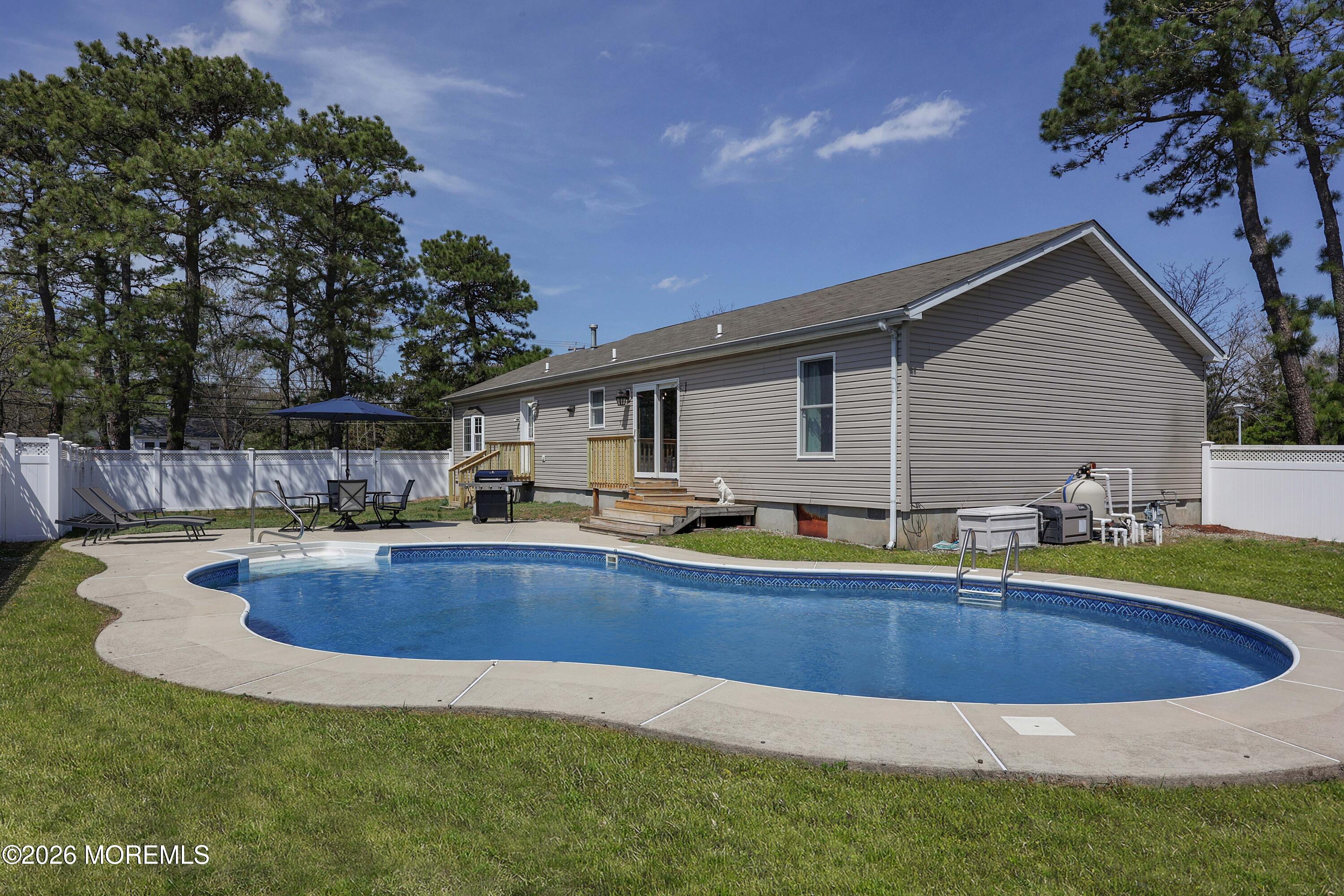 96 Atrium Drive Brick, NJ 08723 - Photo 23 of 39 a view of a house with swimming pool and sitting area