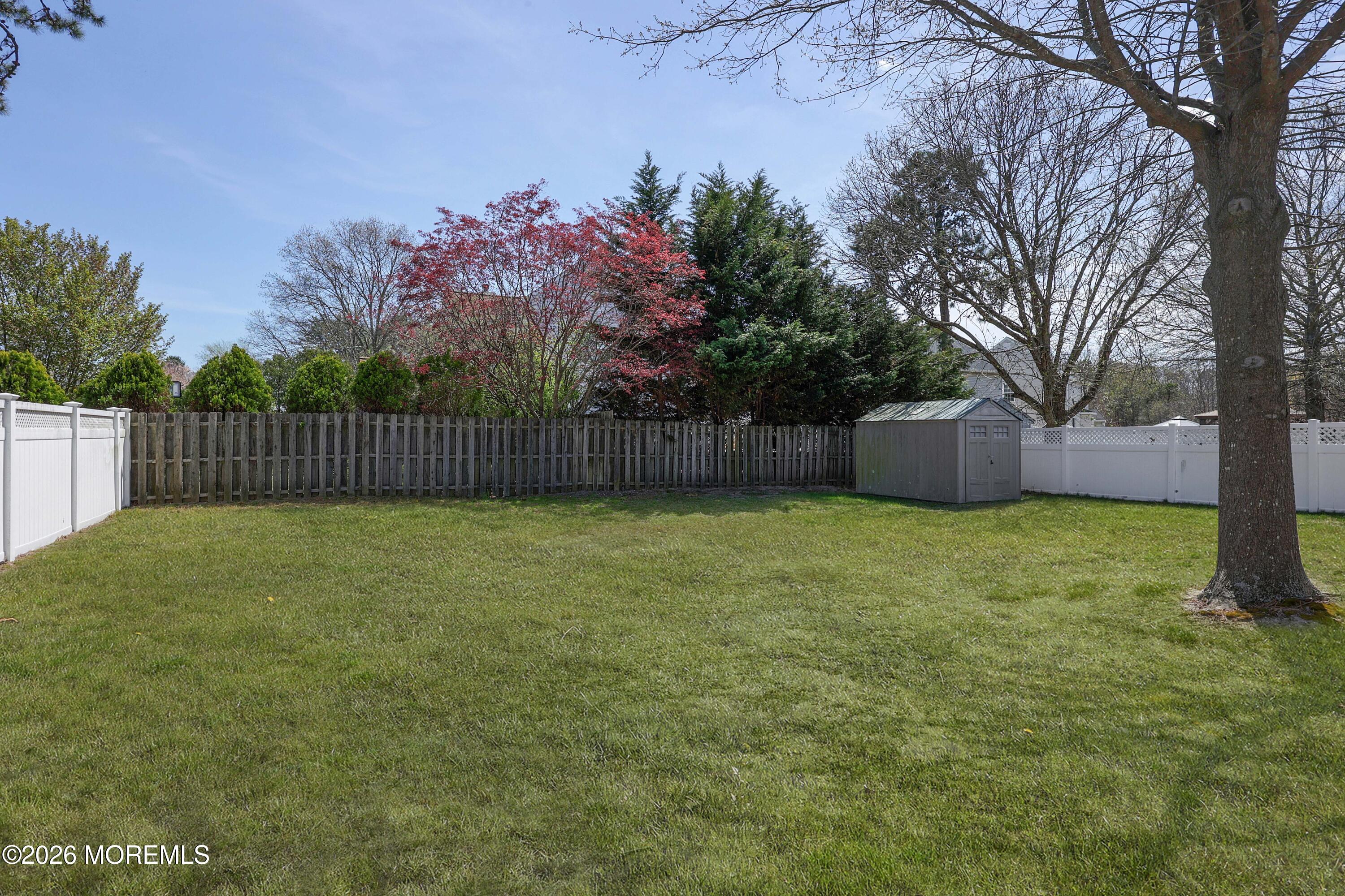96 Atrium Drive Brick, NJ 08723 - Photo 29 of 39 a view of a backyard with a garden