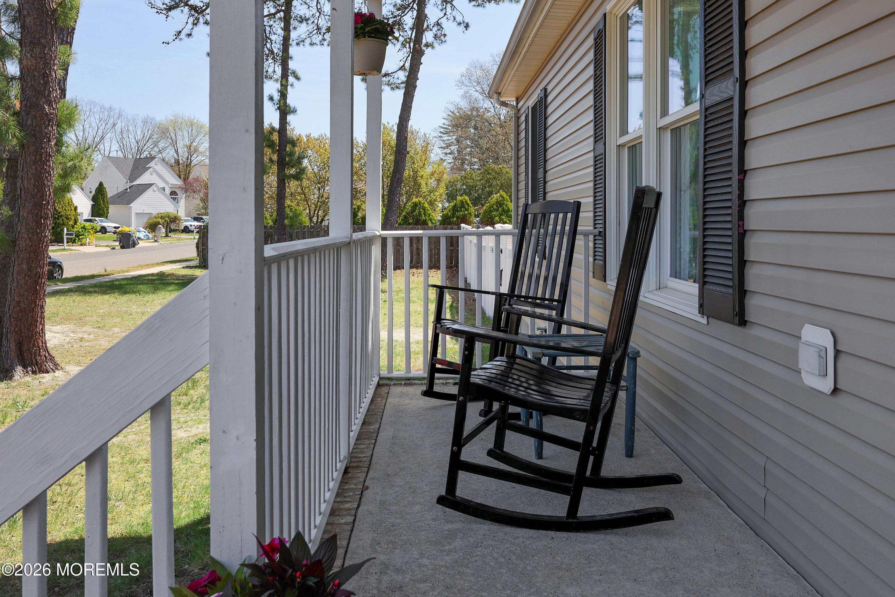 96 Atrium Drive Brick, NJ 08723 - Photo 34 of 39 a view of balcony with wooden floor and outdoor seating