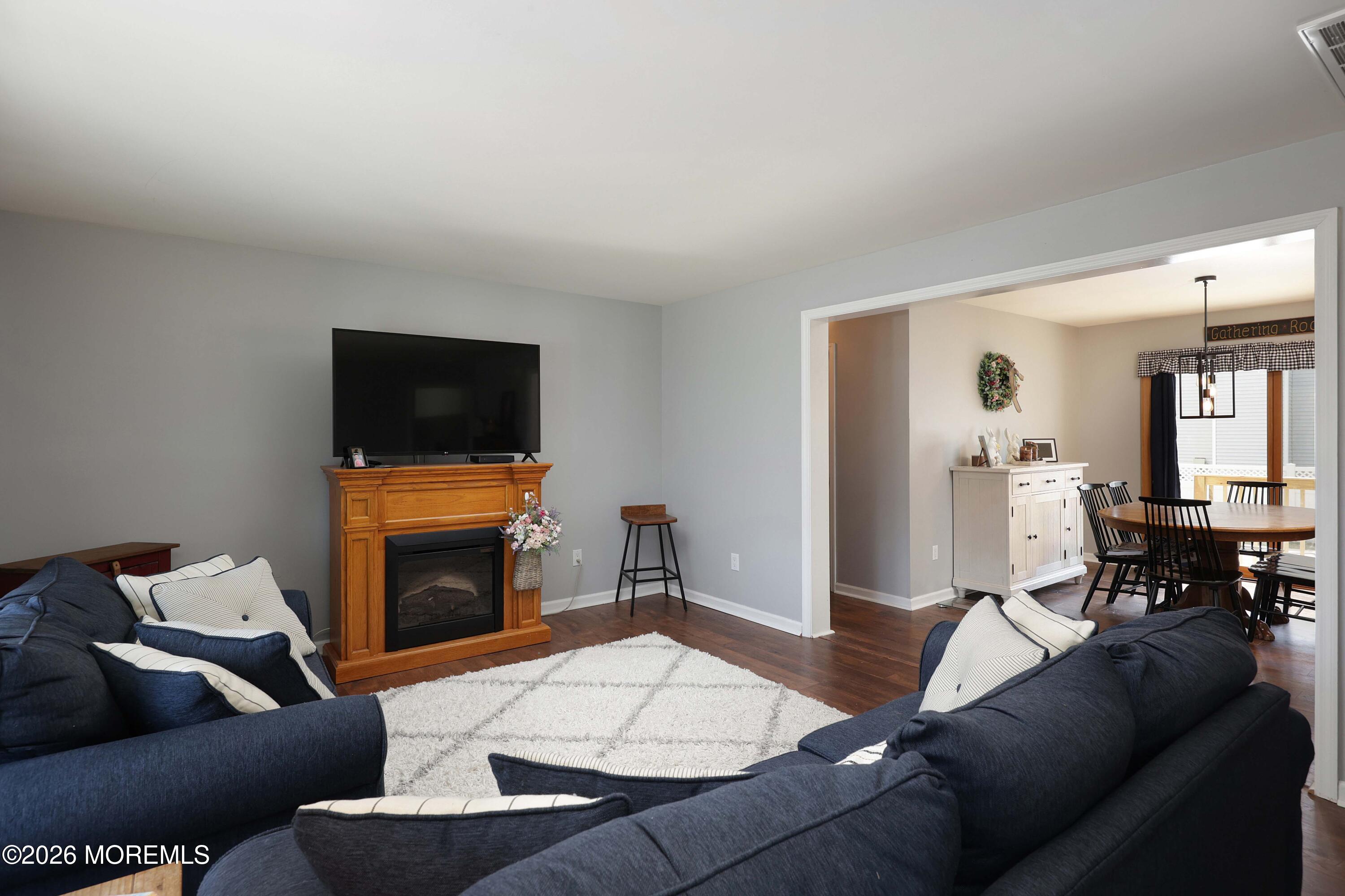 96 Atrium Drive Brick, NJ 08723 - Photo 5 of 39 a living room with furniture and a flat screen tv