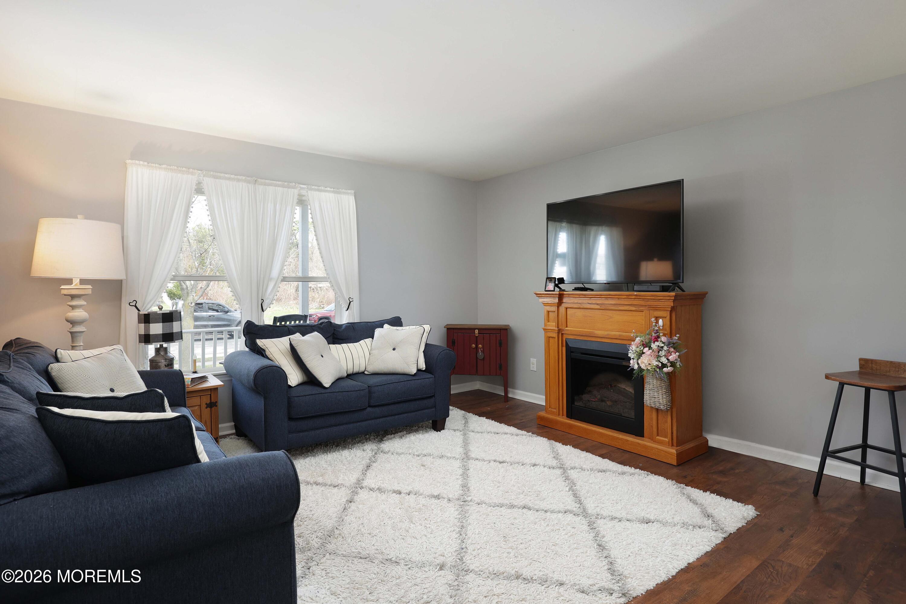 96 Atrium Drive Brick, NJ 08723 - Photo 6 of 39 a living room with furniture and a flat screen tv