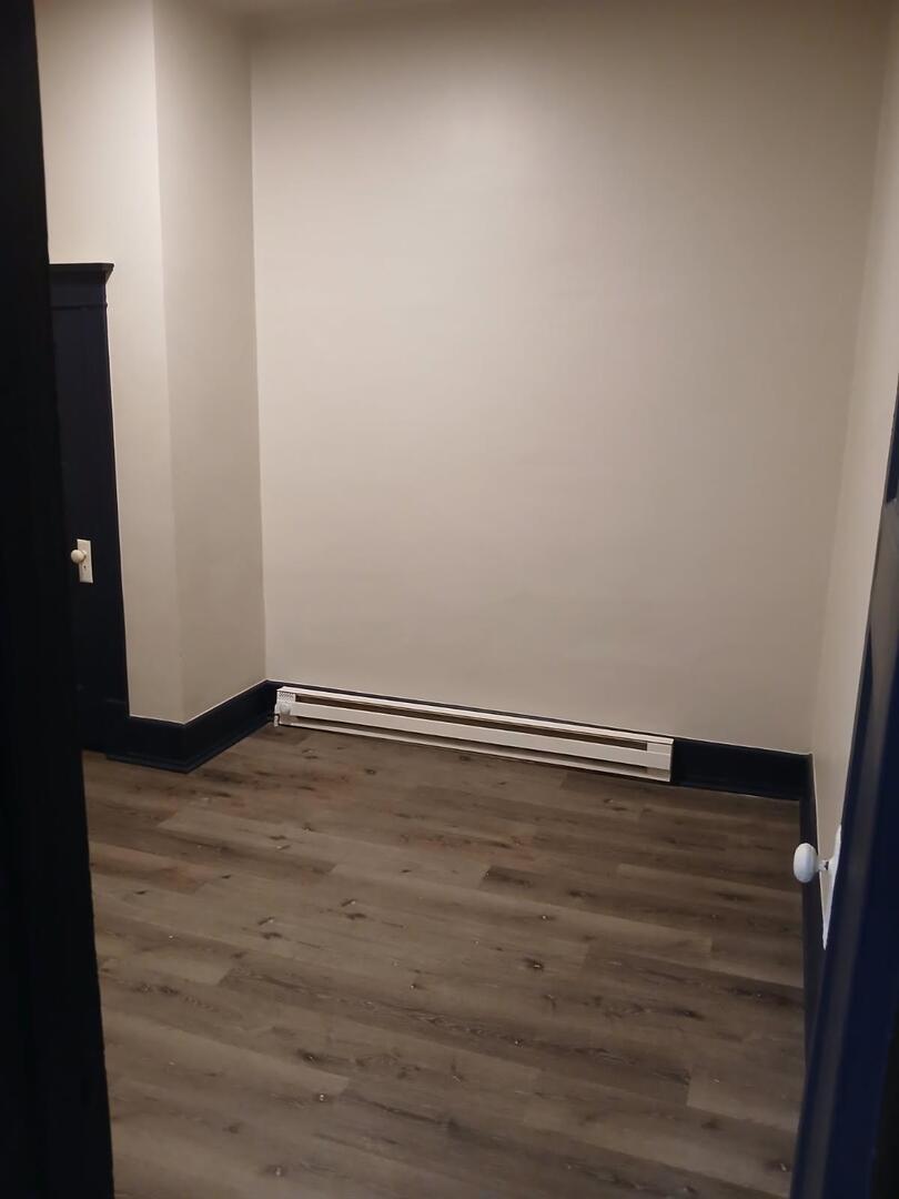 1818 4th Street, Unit 2 Peru, IL 61354 - Photo 13 of 13 a view of an empty room with wooden floor