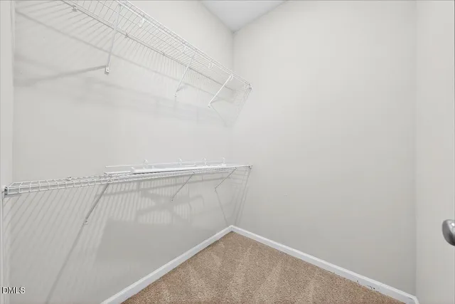 a bathroom with a shower sink vanity mirror and toilet