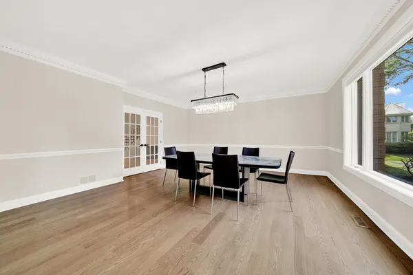 a view of a room with wooden floor