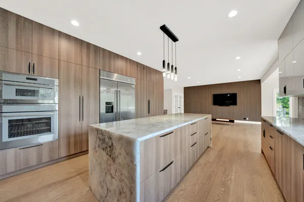 a bedroom with a bed and a flat screen television