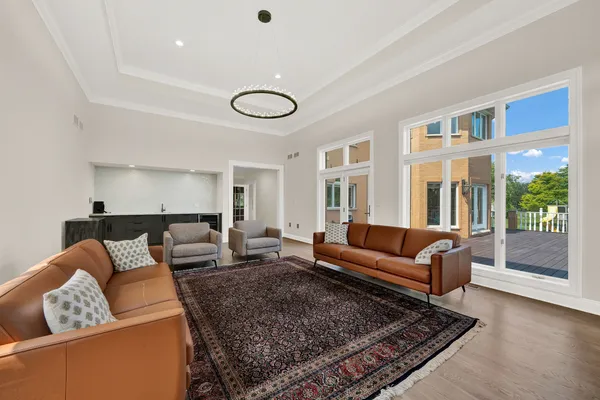 a view of a lake with a big yard and potted plants