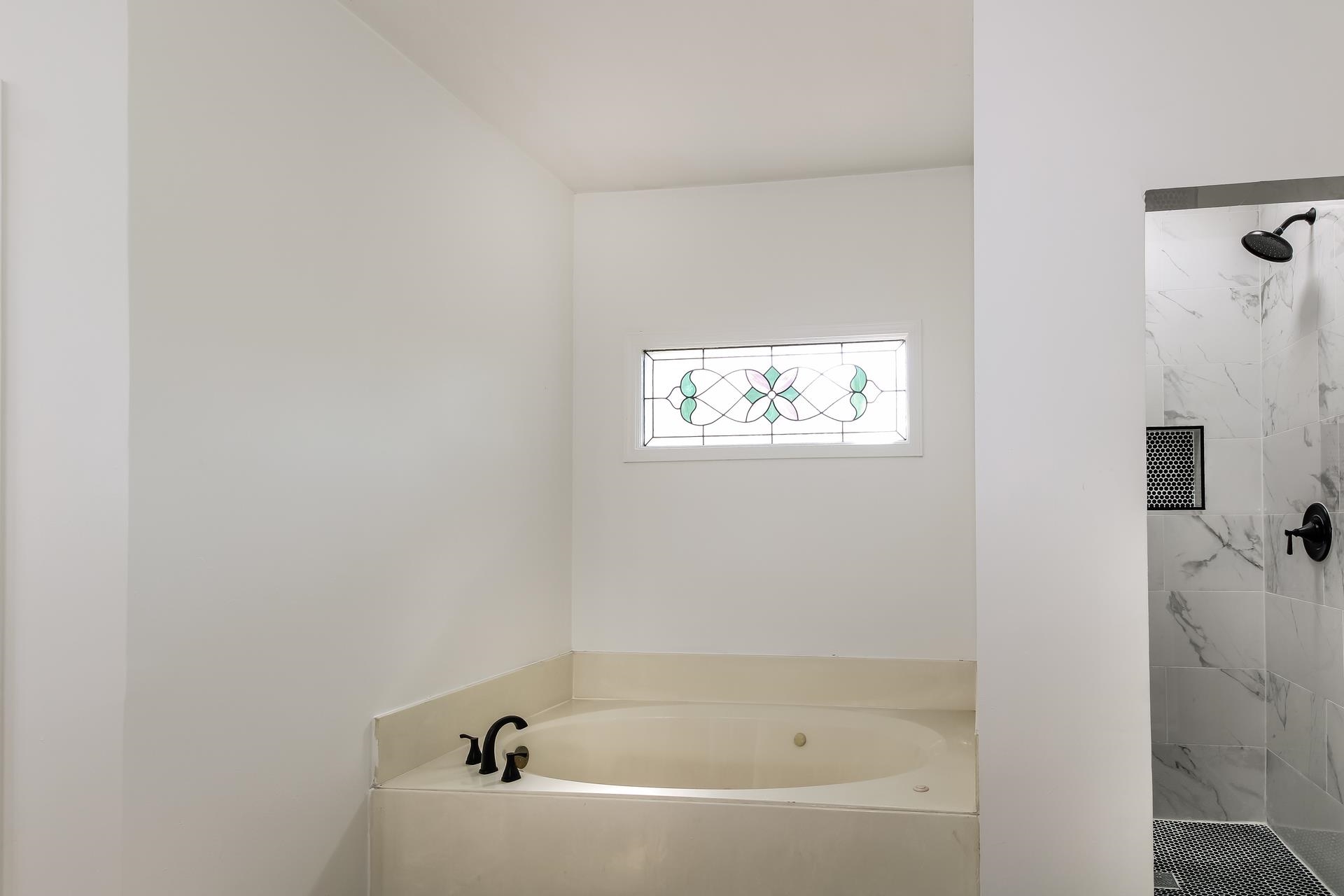 8729 Dexter Road Memphis, TN 38016 - Photo 16 of 20 Full bathroom featuring a garden tub and tiled shower