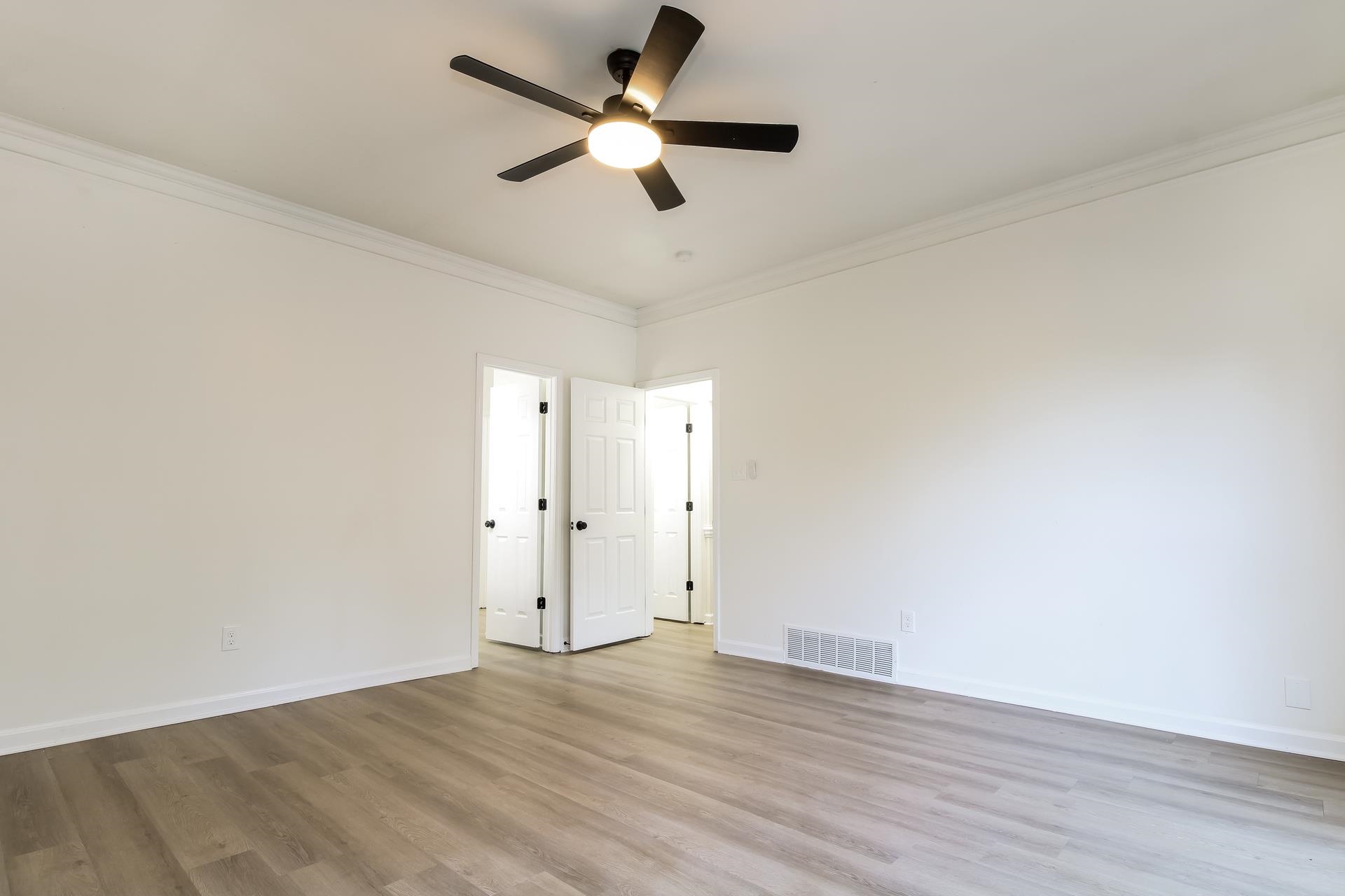 8729 Dexter Road Memphis, TN 38016 - Photo 10 of 20 Empty room with wood finished floors, ornamental molding, and ceiling fan