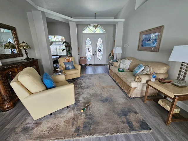 a living room with furniture and a large window