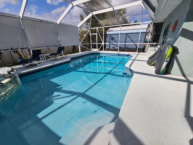a view of storage and utility room with two washing machine