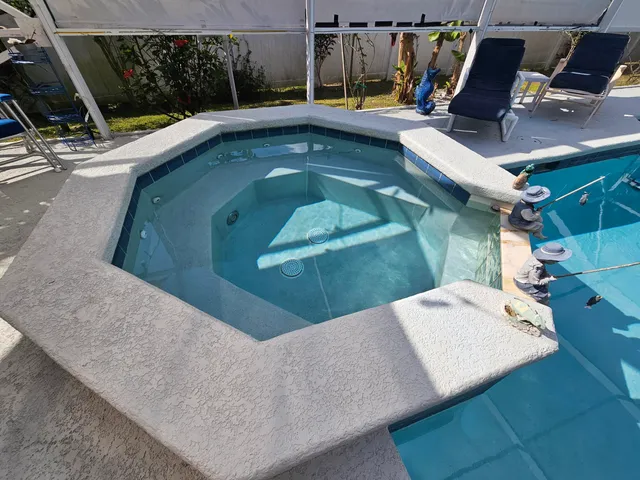 a view of a swimming pool with a patio