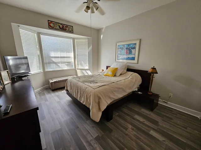 a bedroom with bed and window