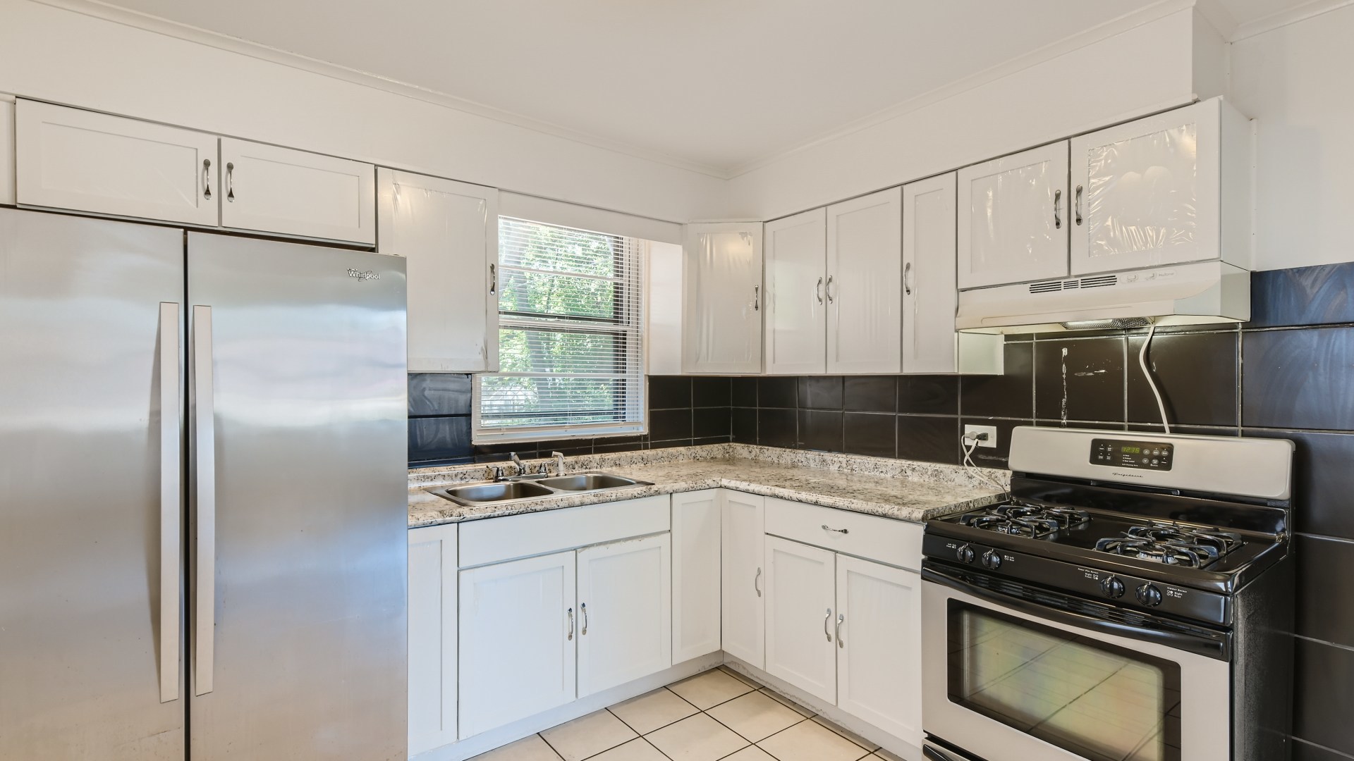 10718 South Pulaski Road Oak Lawn, IL 60453 - Photo 11 of 28 a kitchen with cabinets appliances and a window