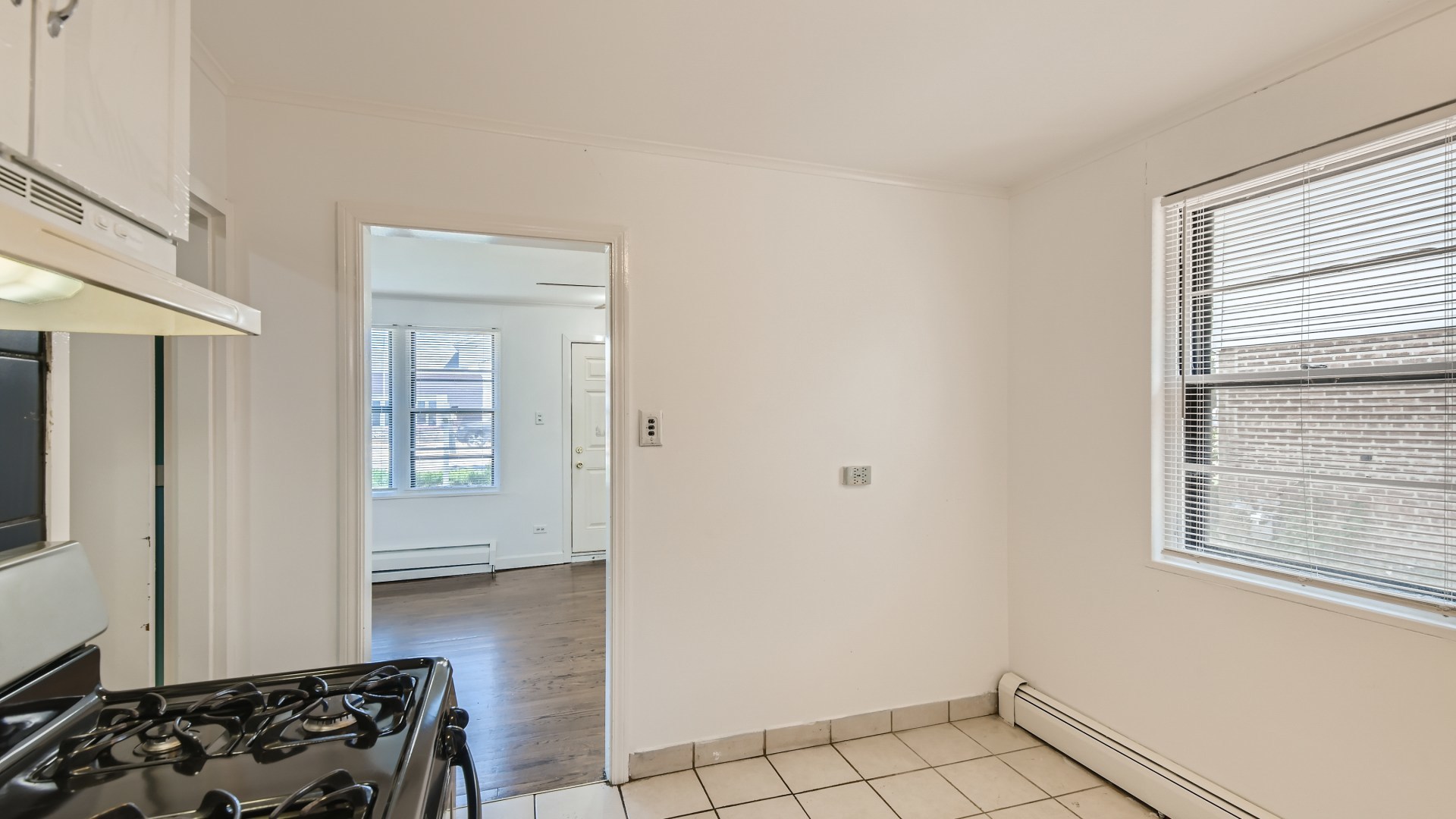 10718 South Pulaski Road Oak Lawn, IL 60453 - Photo 13 of 28 a view of a livingroom with wooden floor and a window