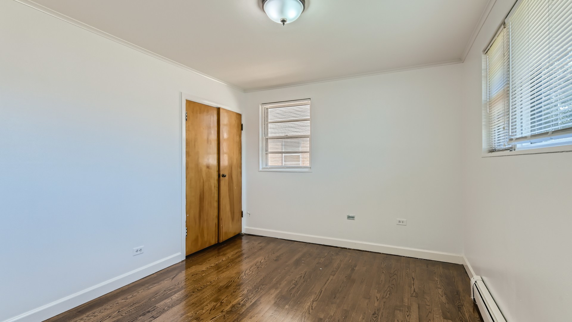 10718 South Pulaski Road Oak Lawn, IL 60453 - Photo 15 of 28 an empty room with wooden floor and windows