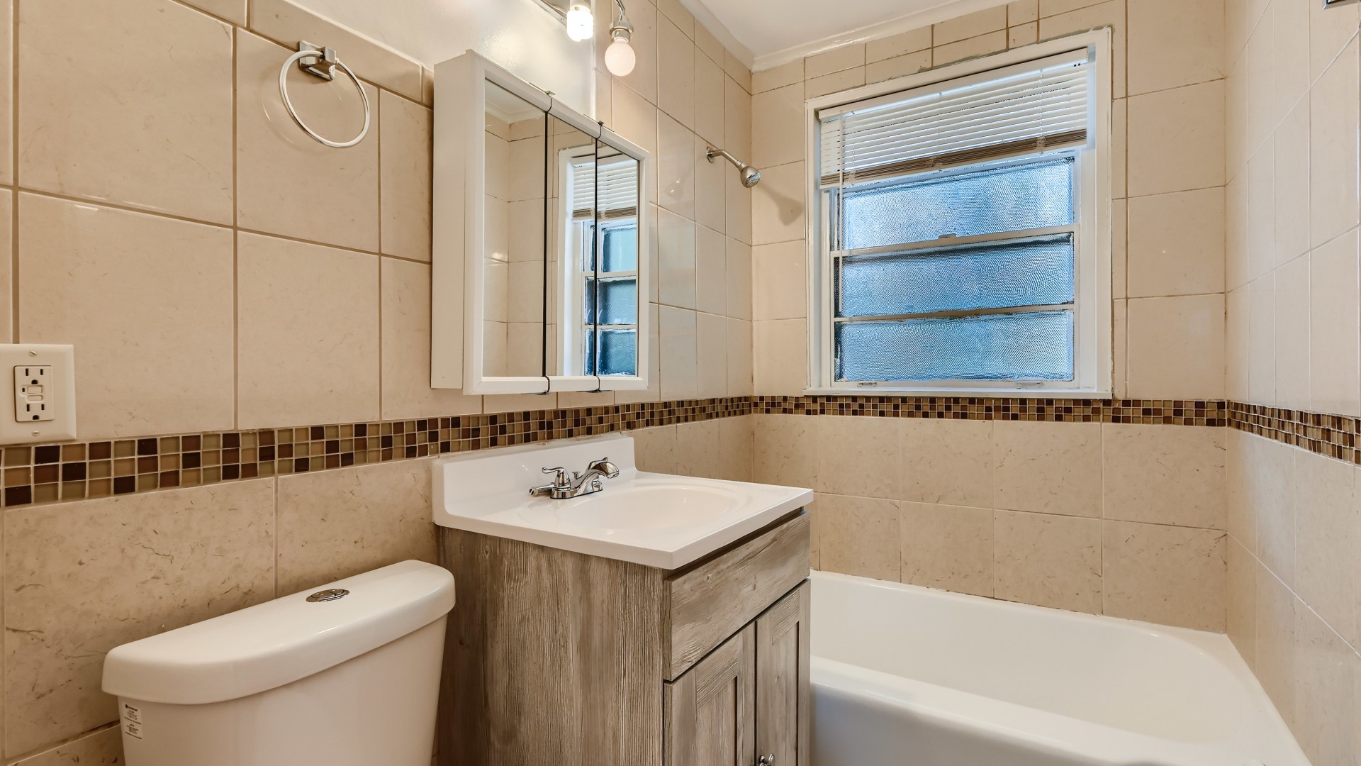 10718 South Pulaski Road Oak Lawn, IL 60453 - Photo 18 of 28 a bathroom with a sink a toilet and a bathtub