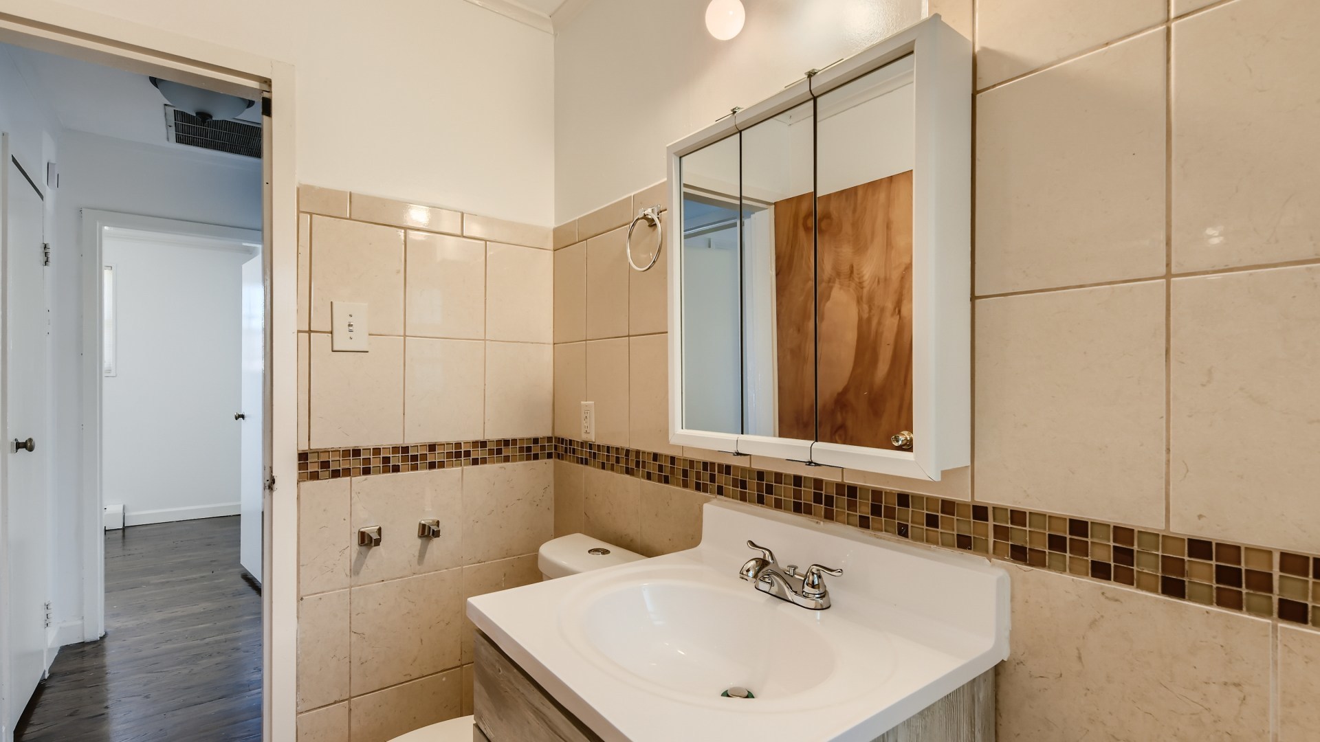 10718 South Pulaski Road Oak Lawn, IL 60453 - Photo 19 of 28 a bathroom with a sink and a mirror