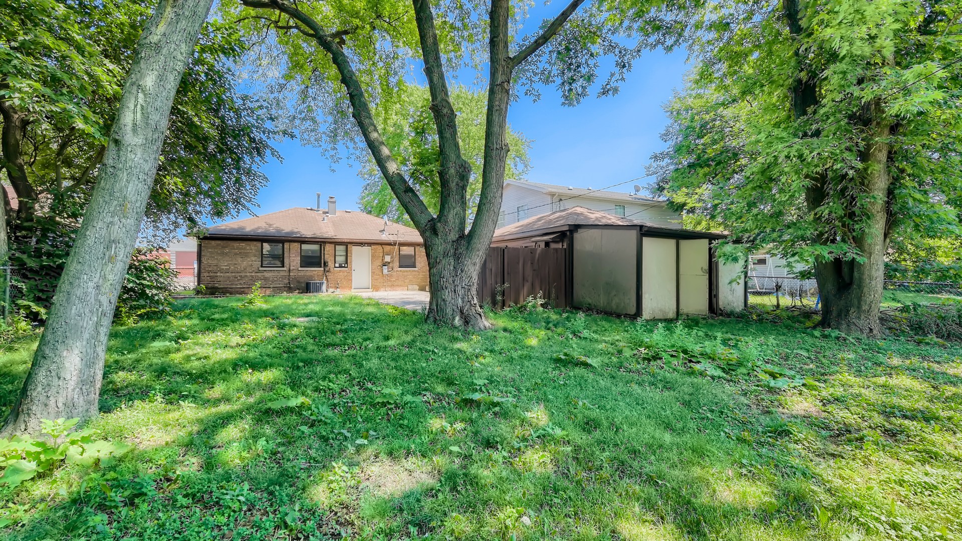 10718 South Pulaski Road Oak Lawn, IL 60453 - Photo 28 of 28 a front view of a house with garden