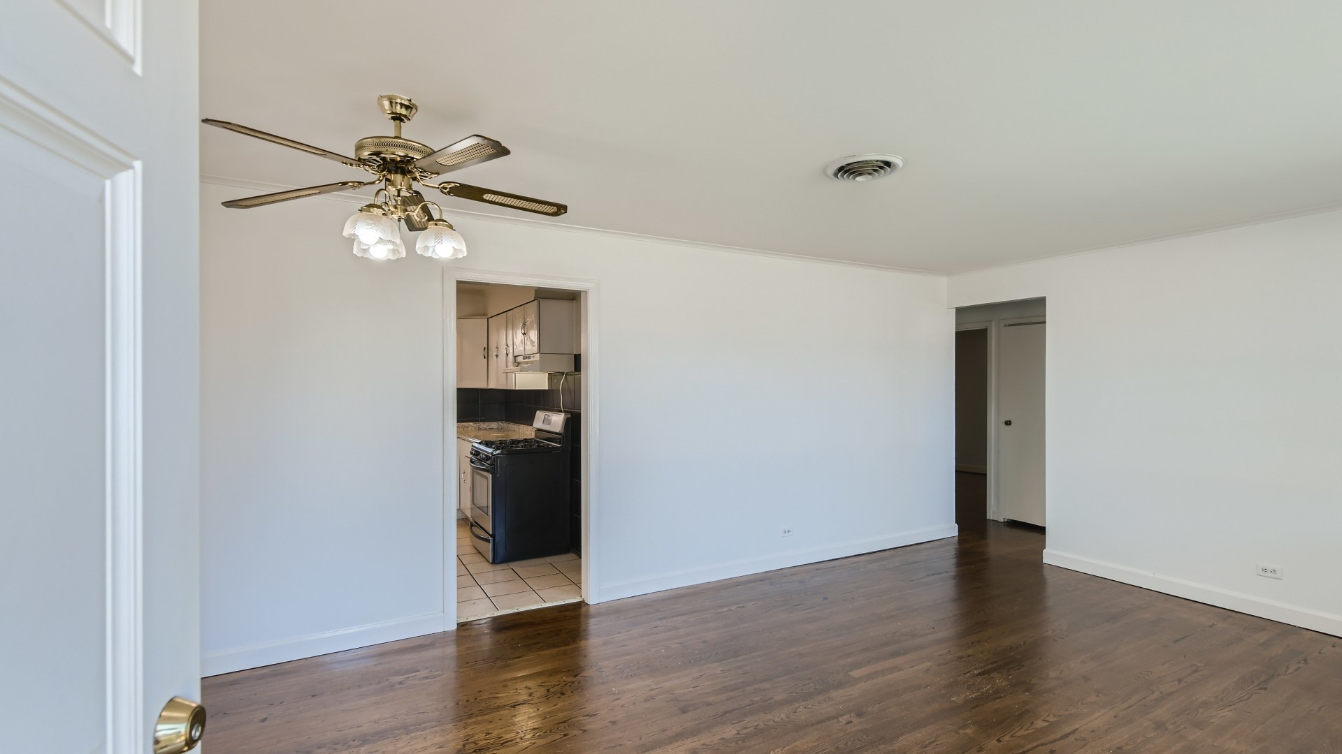 10718 South Pulaski Road Oak Lawn, IL 60453 - Photo 4 of 28 a view of an empty room with wooden floor