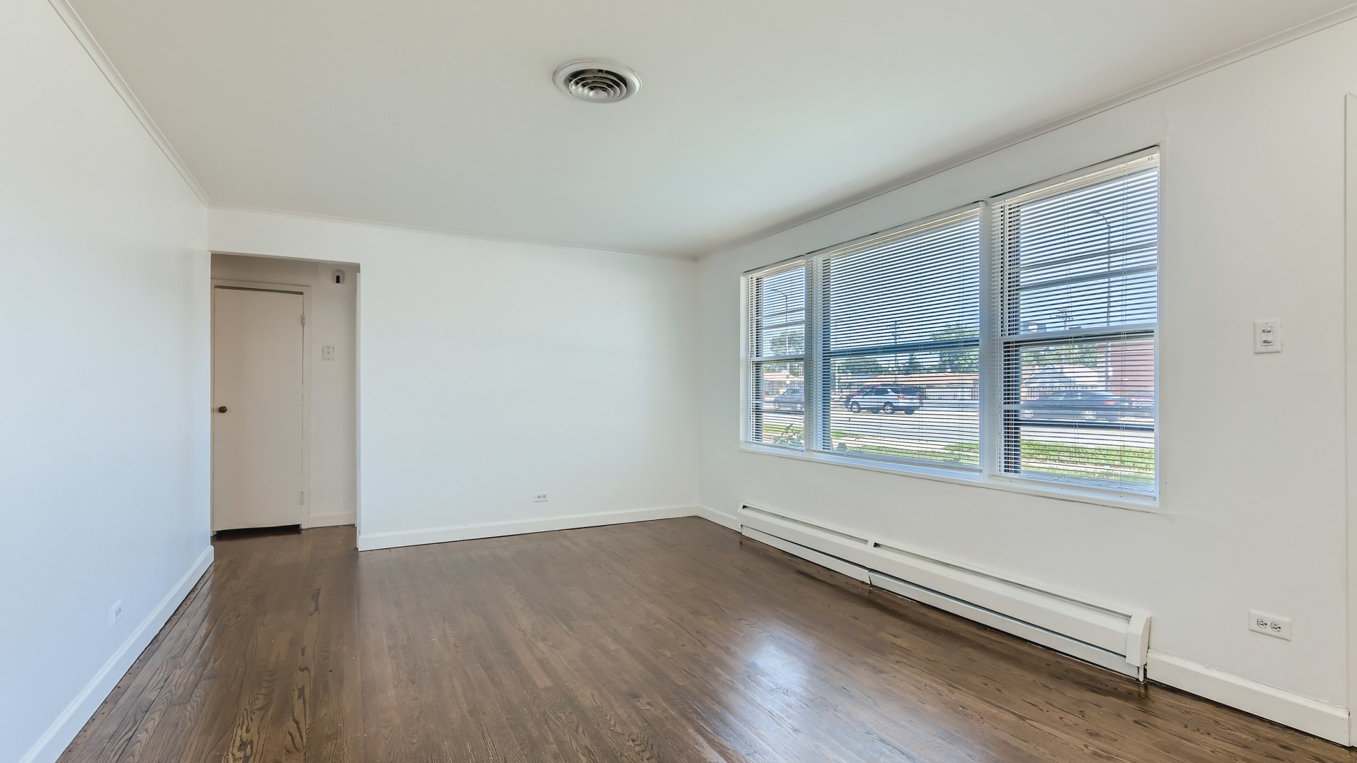 10718 South Pulaski Road Oak Lawn, IL 60453 - Photo 7 of 28 an empty room with wooden floor and windows
