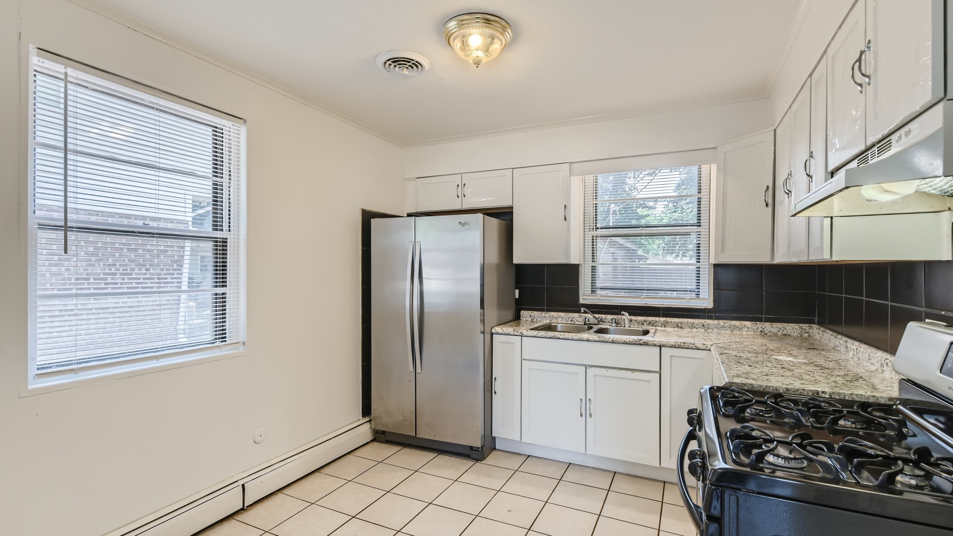 10718 South Pulaski Road Oak Lawn, IL 60453 - Photo 9 of 28 a kitchen with a stove a sink and a refrigerator