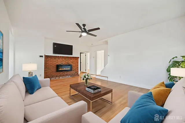 a living room with furniture and a fireplace