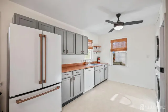 a kitchen with stainless steel appliances a refrigerator and a sink