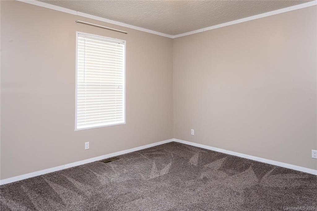 354 Lost Cove Road Clyde, NC 28721 - Photo 9 of 13 an empty room with a window
