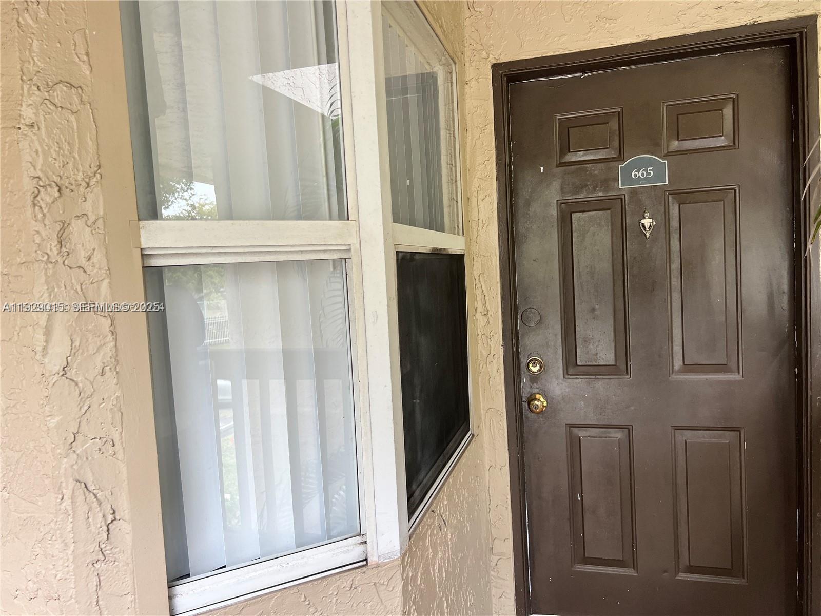 665 Southwest 113th Way, Unit 665 Pembroke Pines, FL 33025 - Photo 4 of 24 view of a door and a door
