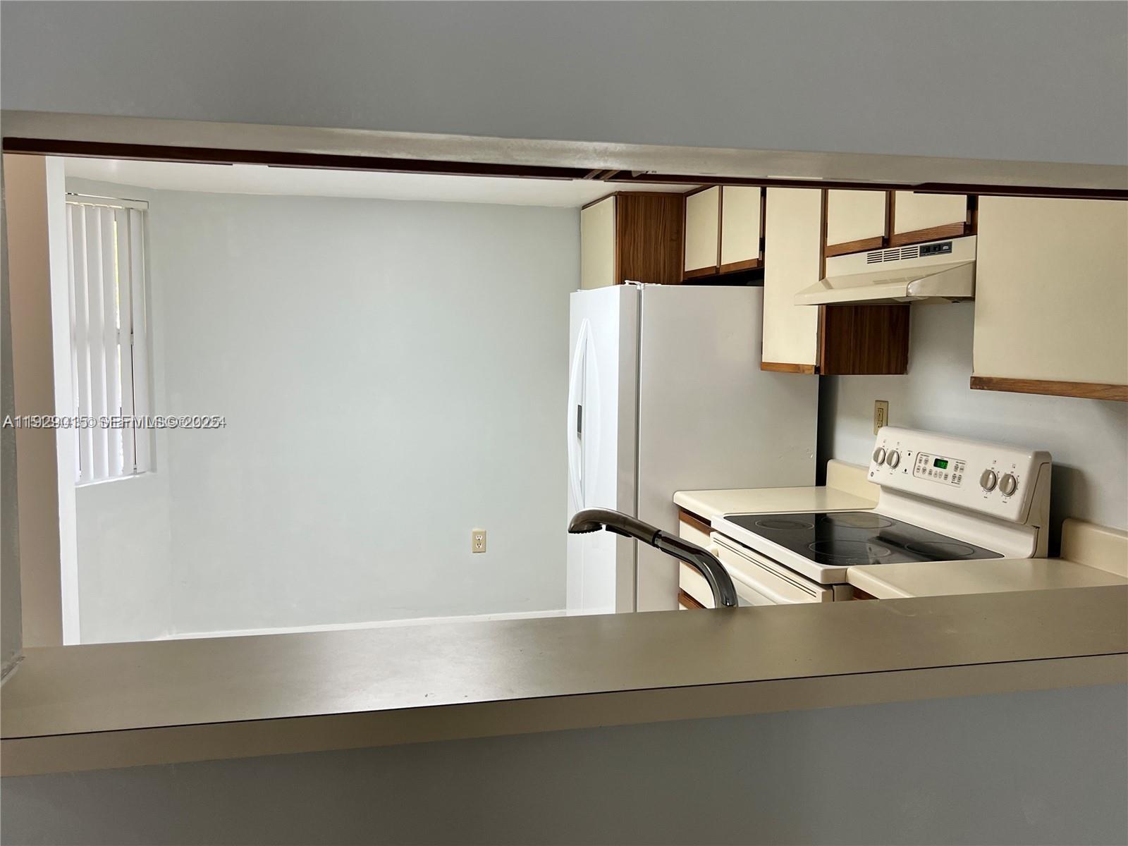 665 Southwest 113th Way, Unit 665 Pembroke Pines, FL 33025 - Photo 7 of 24 a close view of utility room