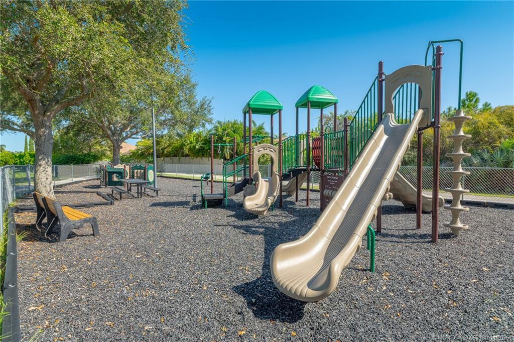 895 Northwest Sassafras Terrace Stuart, FL 34994 - Photo 21 of 23 a view of a park with slide