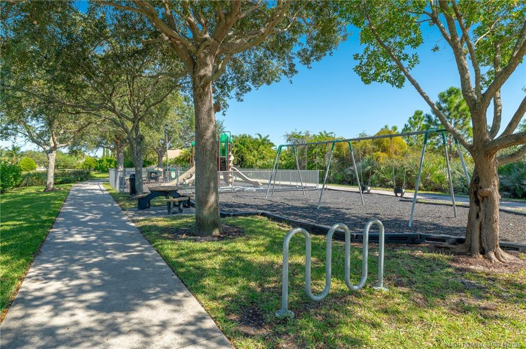 895 Northwest Sassafras Terrace Stuart, FL 34994 - Photo 22 of 23 a view of a park with large trees