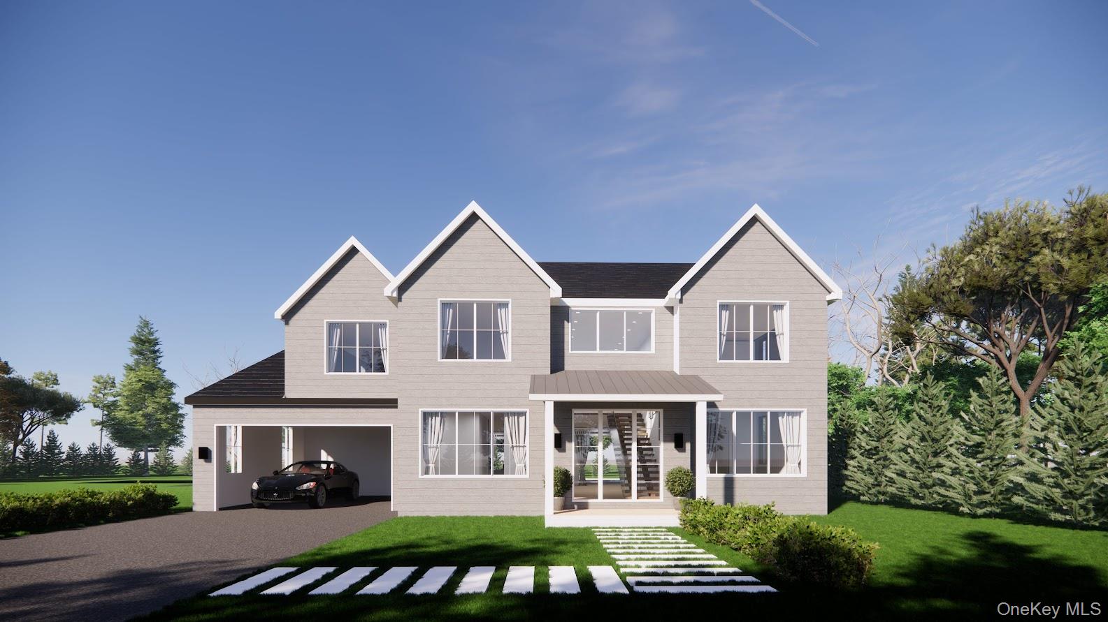 Rear view of property with a lawn and driveway