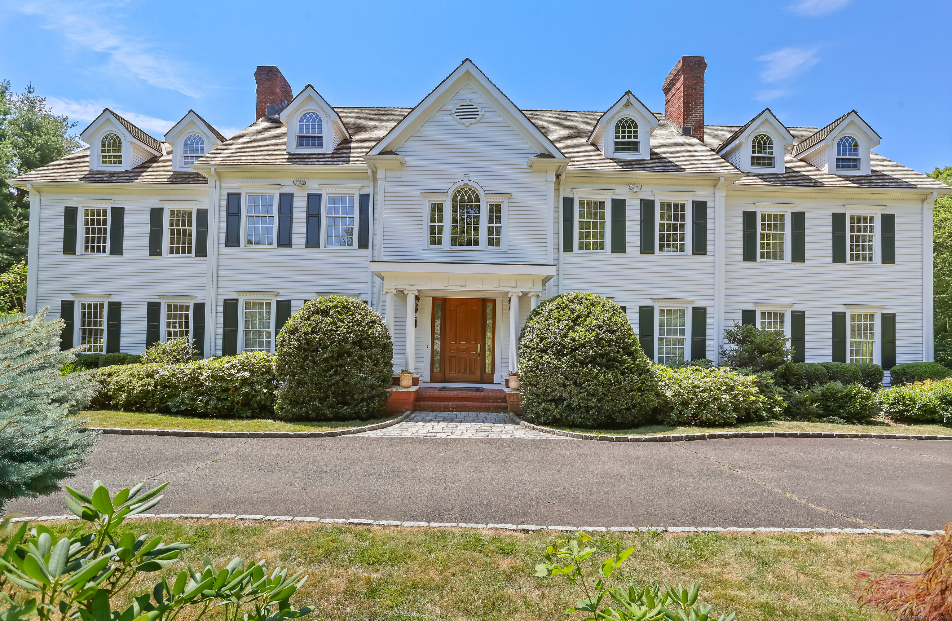 2 Twin Falls Lane Westport, CT 06880 - Photo 1 of 1 a front view of a house with a yard
