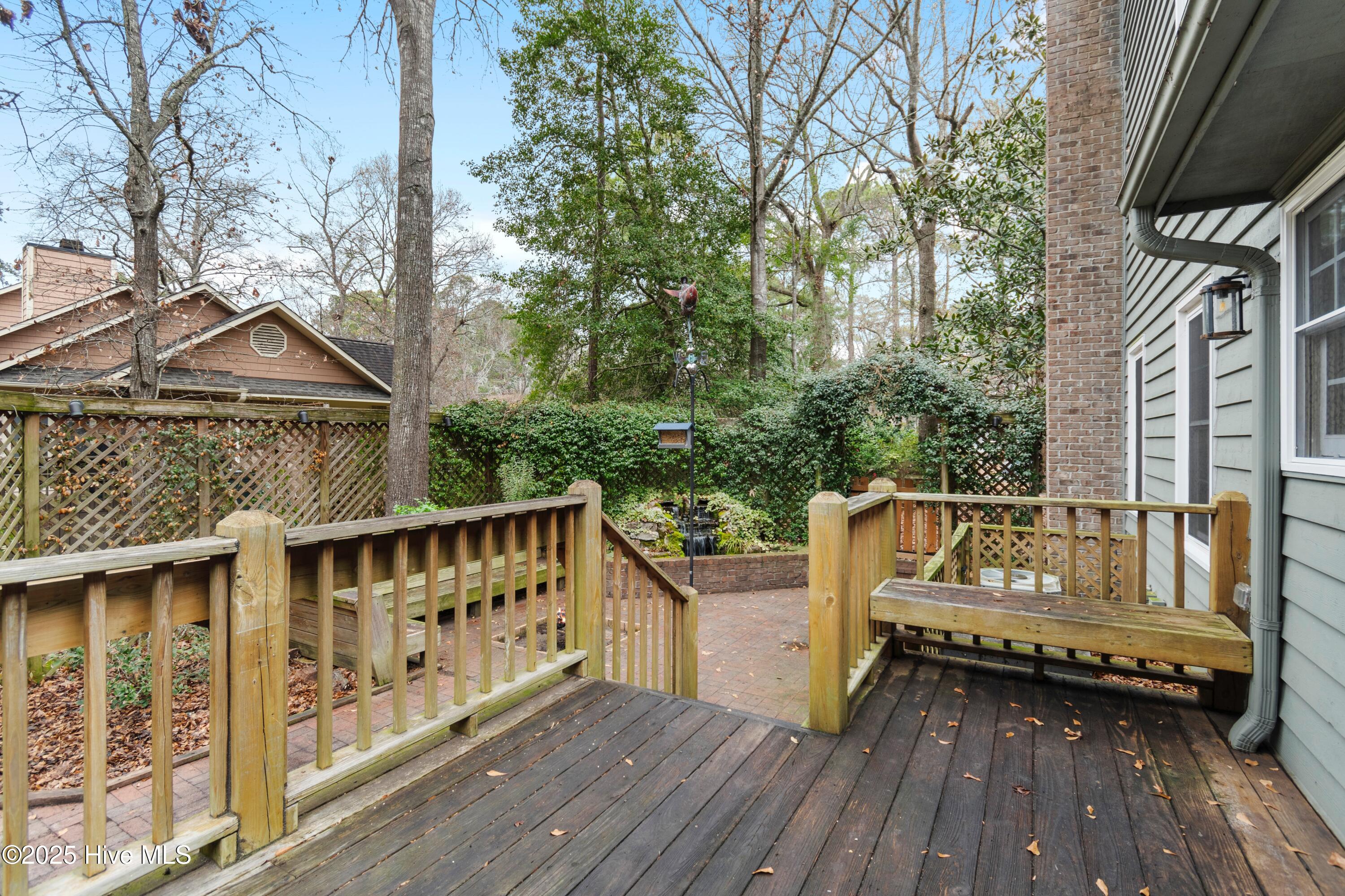103 Ridge Road Hampstead, NC 28443 - Photo 42 of 60 Deck (with built in flower boxes) to Fountain/Fire Pit (access from Flex Space)