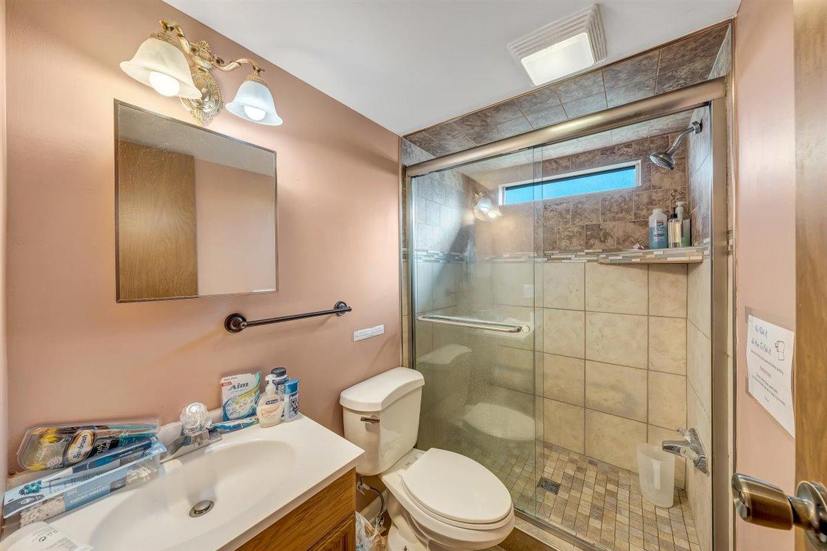 12595 Hardy Road Hardy, VA 24101 - Photo 13 of 33 a bathroom with a sink mirror vanity and toilet