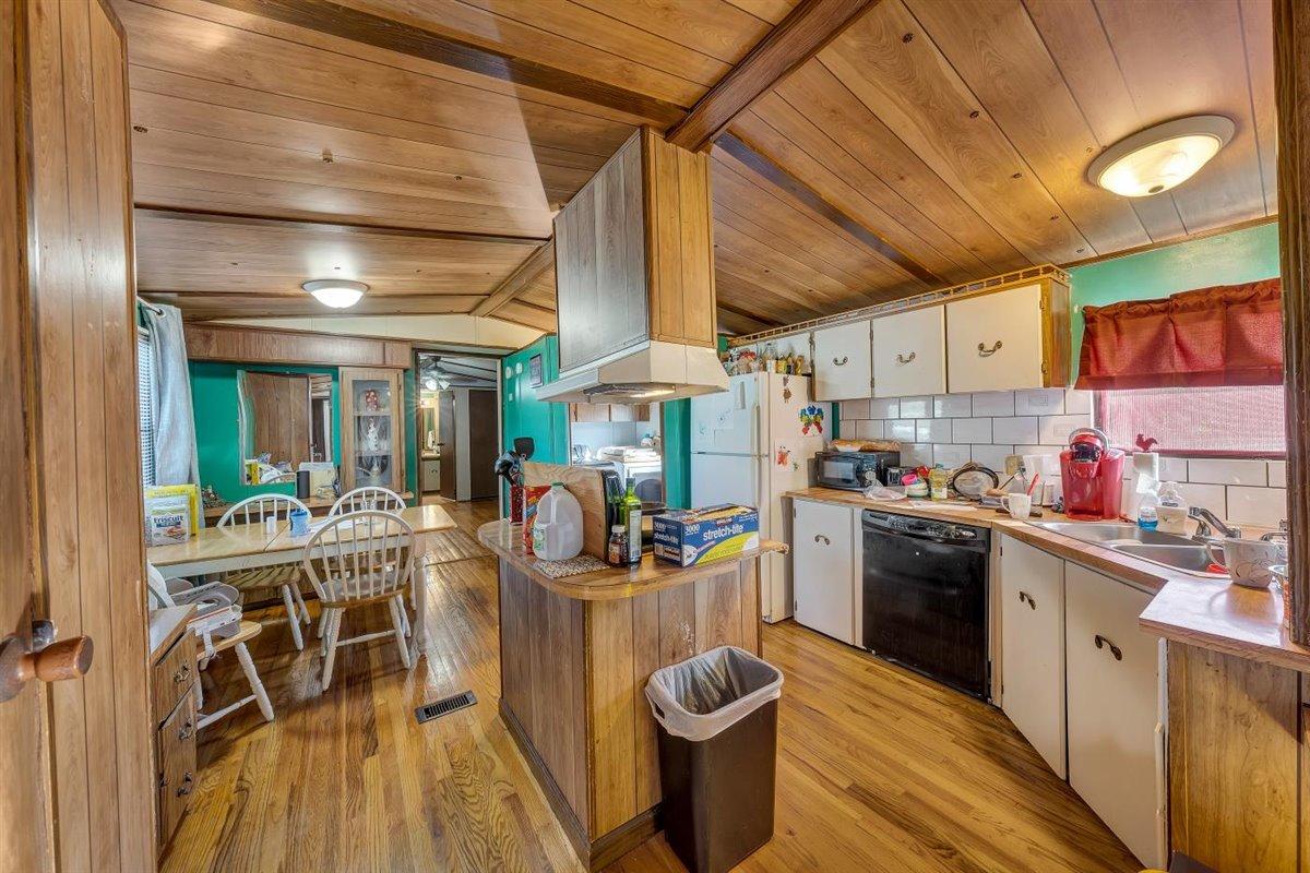 12595 Hardy Road Hardy, VA 24101 - Photo 20 of 33 a view of a kitchen with dining table and chairs