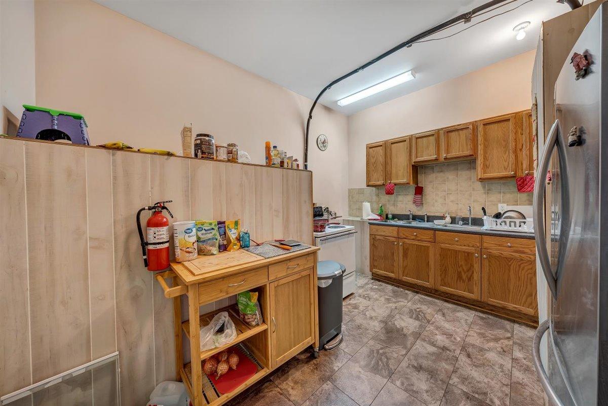 12595 Hardy Road Hardy, VA 24101 - Photo 5 of 33 a utility room with stainless steel appliances a stove a sink and a refrigerator