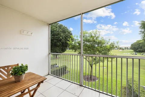 a balcony with view of an outdoor space
