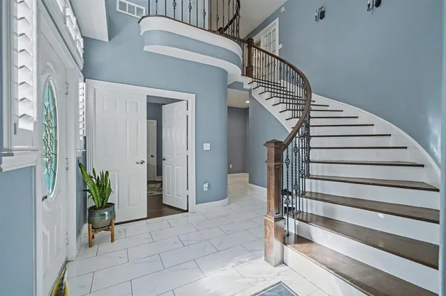 a view of entryway with a front door